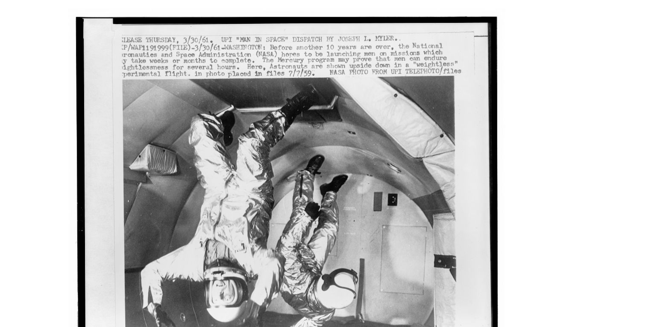Project Mercury astronauts shown floating upside down during weightless experimental flight